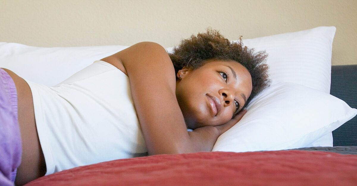 woman-resting-on-her-bed-1200x628-facebook-1200x628