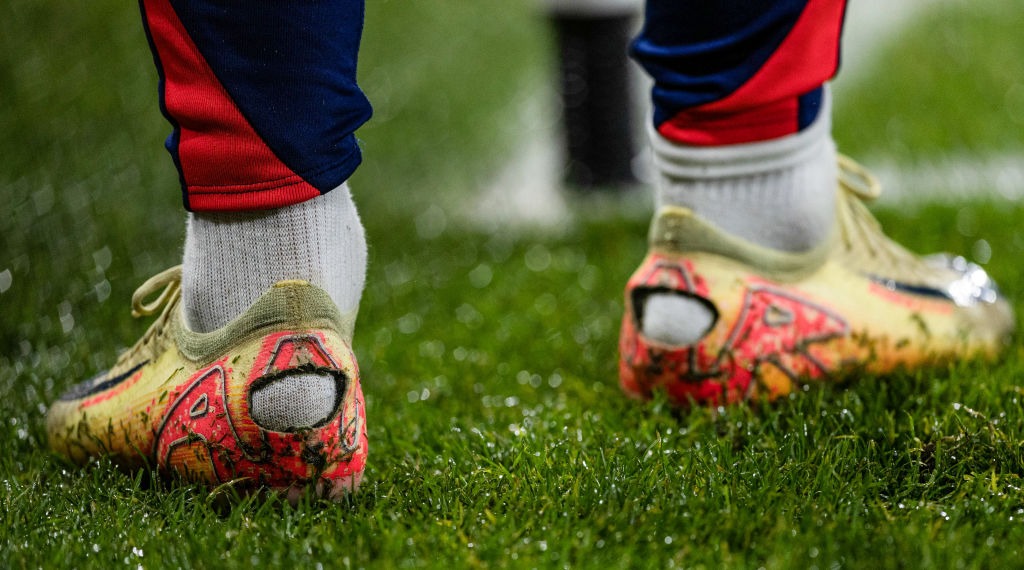boots-football-holes